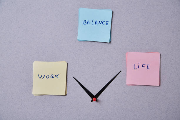 istock Work life balance choice concept. Clock arrows between stickers with inscriptions 1167244729