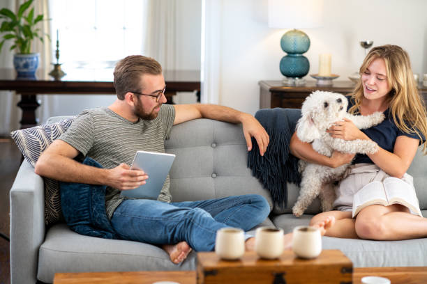 istock Husband and Wife Relaxing with their Dog 1167248704