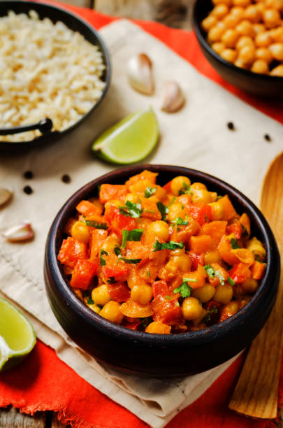 istock chickpeas carrots pepper coconut milk curry with brown rice 1167248903
