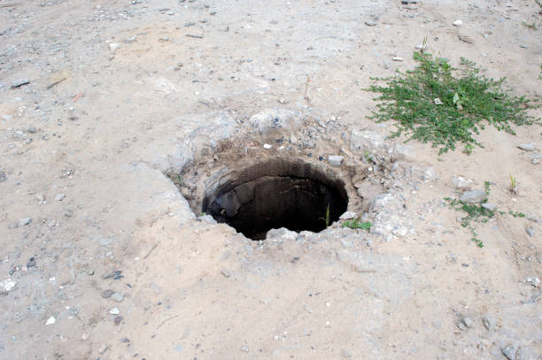 istock Sewer well without manhole cover on an abandoned construction site 1167251303