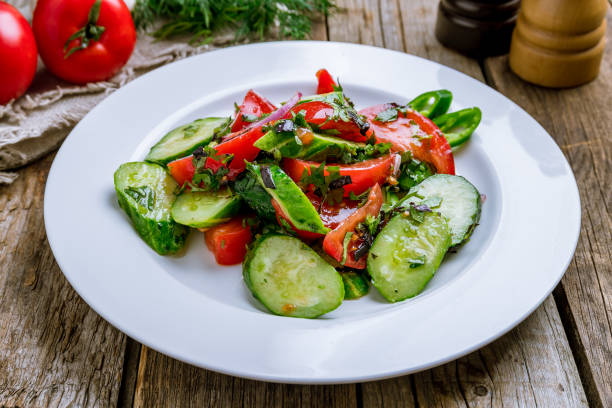 istock Vegetable salad with tomatoes and cucumbers 1167252980