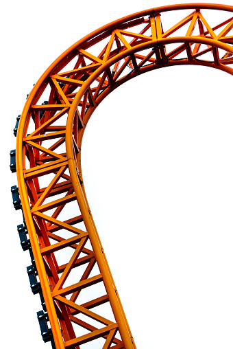 Curved of orange Roller Coaster track in close up isolated on white background.