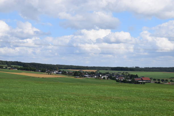 istock green Eifel hills with villages 1167254507