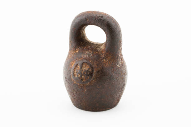 istock Antique vintage rusted iron weight macro on white background 1167256233