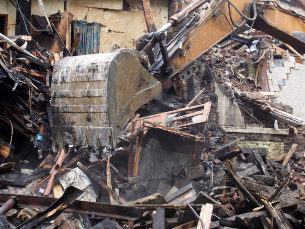 istock Hydraulic excavator machine working on a demolition site clearing debris 1167257305