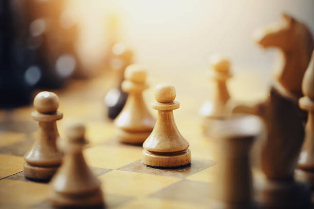 istock Wooden chess pieces on the chessboard. 1167260758