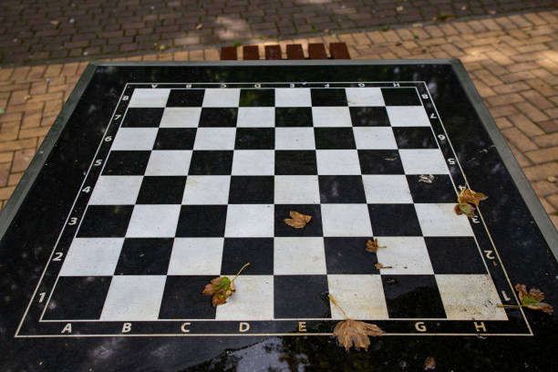istock A small chess table in the park. Empty board game table. Summer season. 1167262735