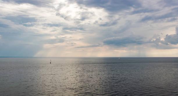 istock The sun's rays through the clouds illuminate the sea. 1167262869