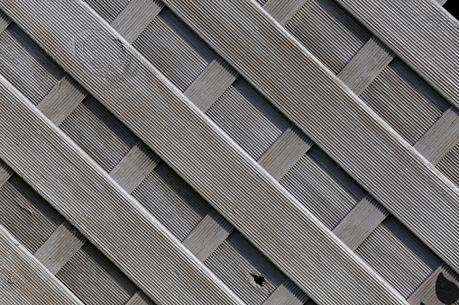 Fence from plastic material imitating wood.
