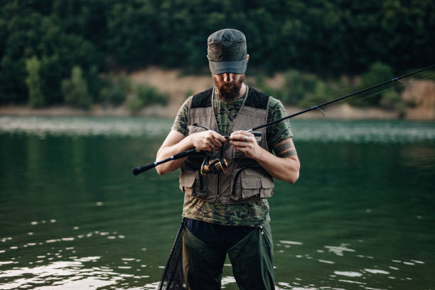 istock Young man fishing 1167268012