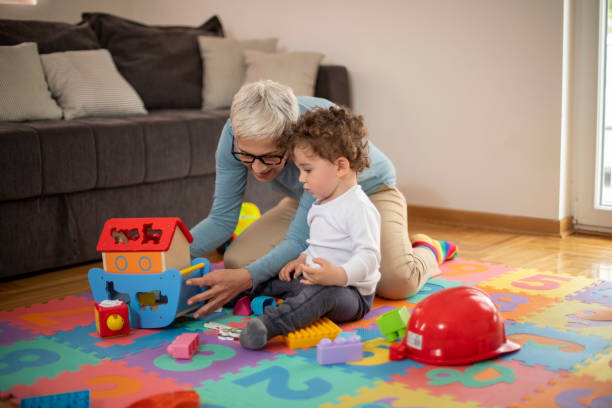 istock Grandmother playing with her grandson 1167268020
