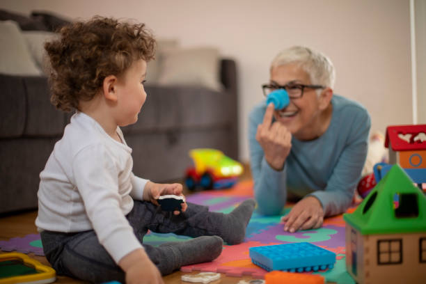 istock Grandmother playing with her grandson 1167268035