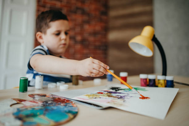 istock Happy little boy coloring 1167270059