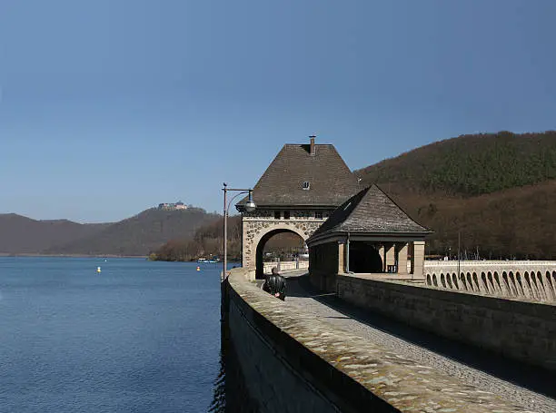 Reservoir Edersee and dam with the castle of Waldeck in the background. This lake is located in northern Hesse between Kassel, Sauerland and Kellerwald in Germany.