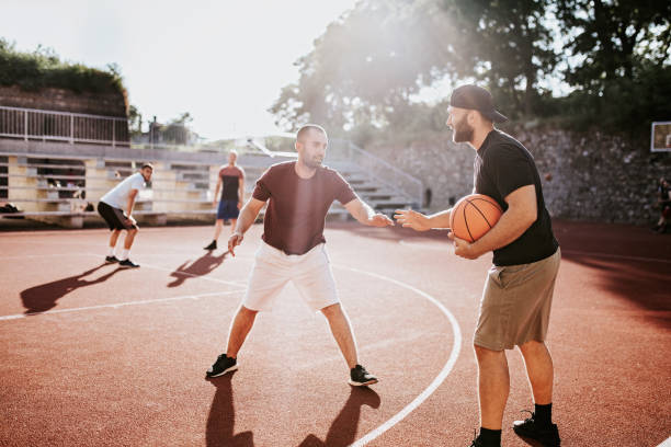 istock Basketball players on court 1167275841
