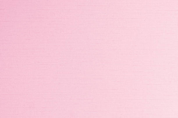 istock Fine authentic silk fabric wallpaper texture pattern background in shiny light bright pink purple color tone 1167277409