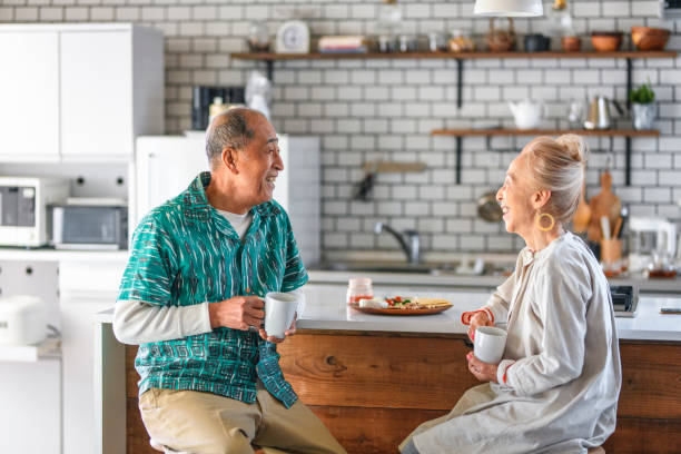 istock Senior Japanese Couple Enjoying Breakfast at Kitchen Counter 1167284454