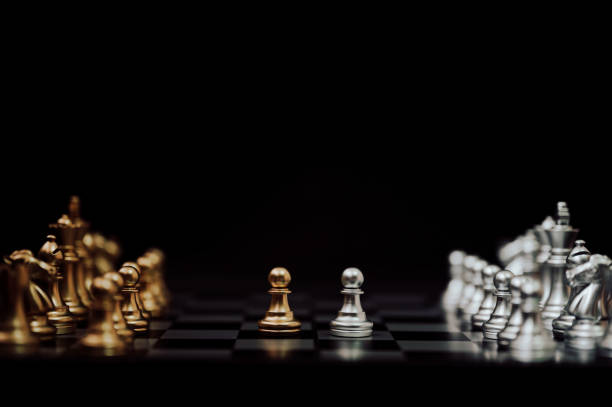 istock Business competition and strategy plan concept. Chess board game gold and silver colour 1167286589