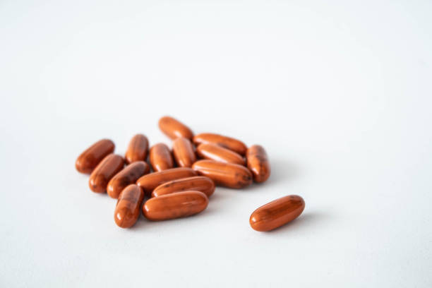 istock orange pills ona white background laying there 1167301062