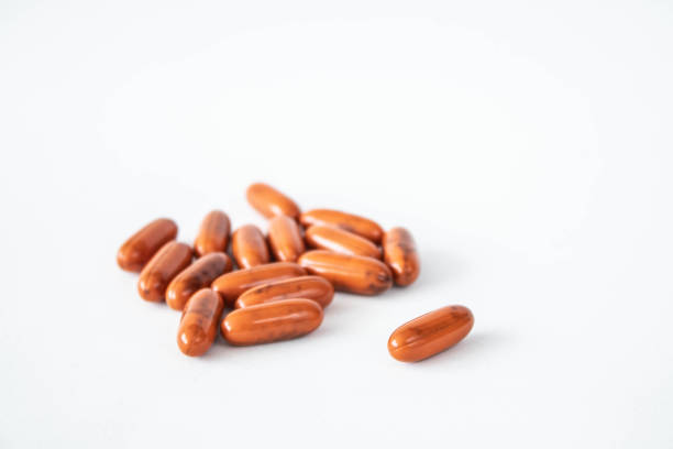 istock orange pills ona white background laying there 1167301068