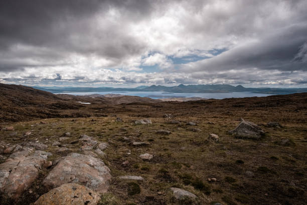 View of Isle of Skye from Bealach n Ba in Scotland View across Inner Sound of Raasay towards the Isle of Skye from the 626 metre high viewpoint at Bealach na Ba in Wester Ross on the west coast of Scotland applecross peninsula stock pictures, royalty-free photos & images