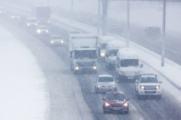istock Traffic On highway During Snow Storm 1167302671