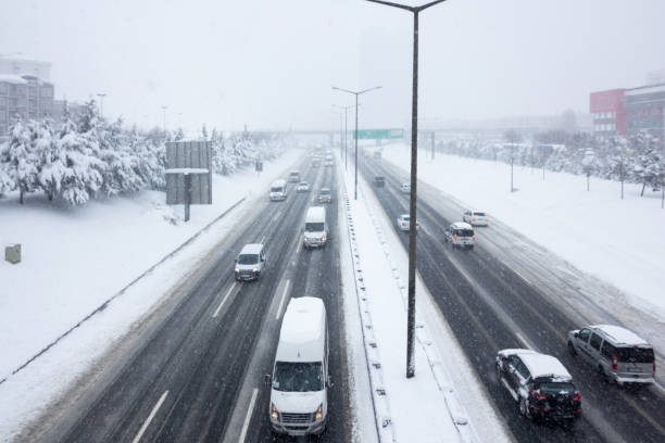 istock Traffic On highway During Snow Storm 1167302677