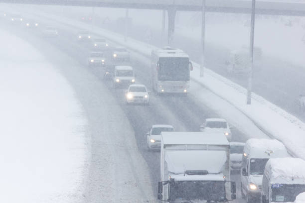 istock Traffic On highway During Snow Storm 1167302681