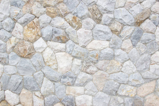 istock Brick stone wall stack of medieval natural stone texture background or rock strata boundary the rock seamless abstract and fragment of a walls from a gray. 1167302846