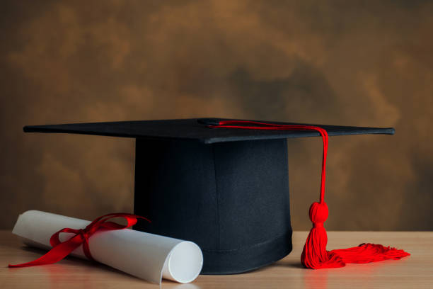 istock Graduation cap and certificated on wooden background.Concept education congratulation. 1167305723