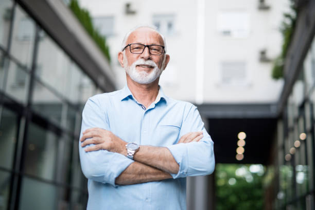 istock Senior businessman with arms crossed looking at camera. 1167309813
