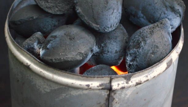istock Coal briquettes burning in chimney starter 1167310104