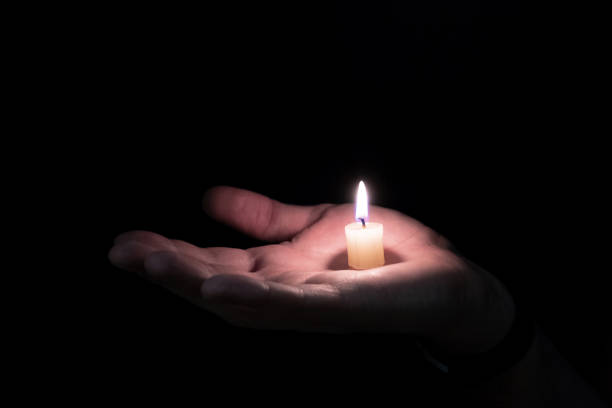 istock on the open hand is the candle and lights 1167320435