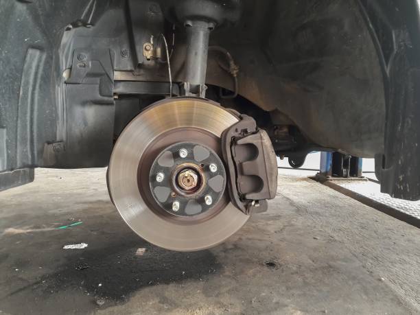 istock Cars changing wheels and brakes 1167321581