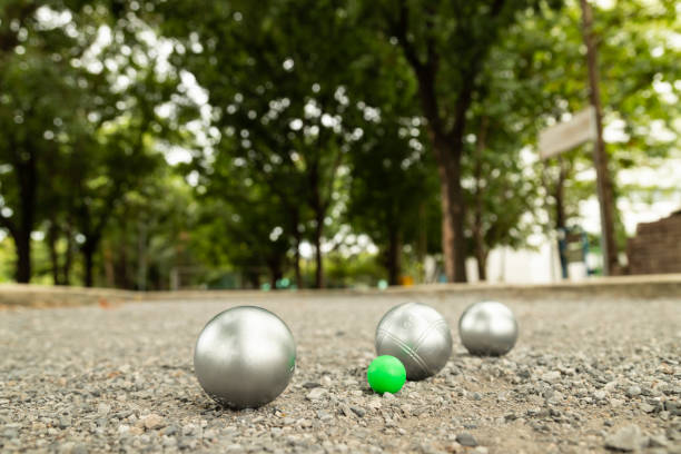 istock Petanque balls in the playing field with shady trees as a backdrop. Selectived focus. 1167323736
