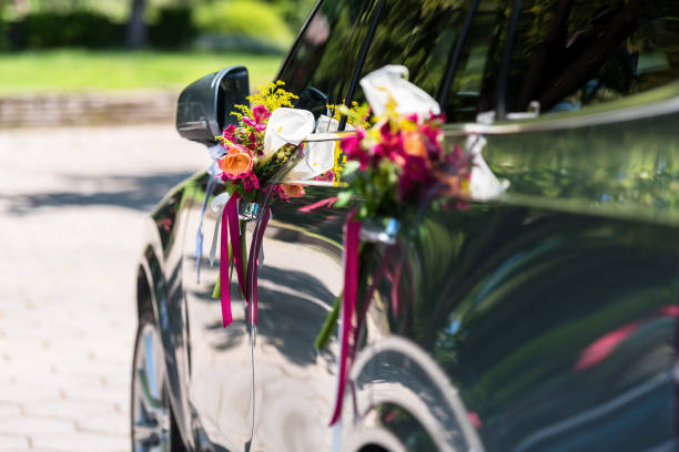 Wedding bouquet on new wedding car!