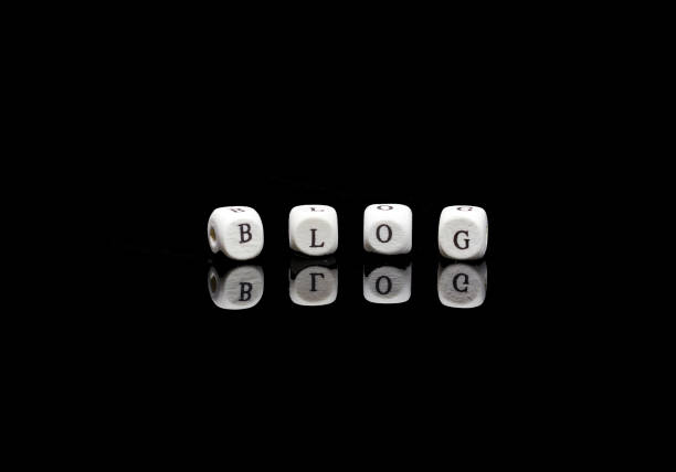 istock BLOG on wooden cubes on black background with reflection 1167325818