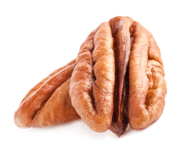 istock Peeled pecan nuts isolated on white background with clipping path 1167326432