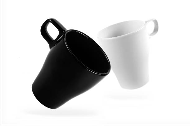 istock White mug and black mug on a white background 1167326946