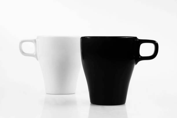 istock White mug and black mug on a white background 1167327527