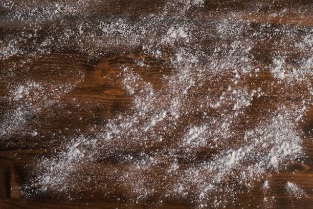 Flour on table, texture background flour scattered on the table. stock photo