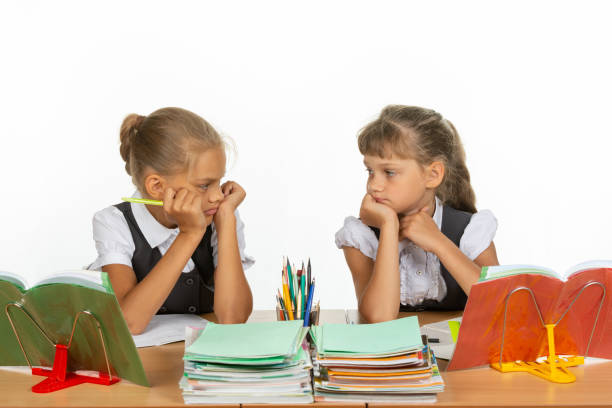 istock Sad schoolgirls in class received a deuce, and looked at each other 1167332436
