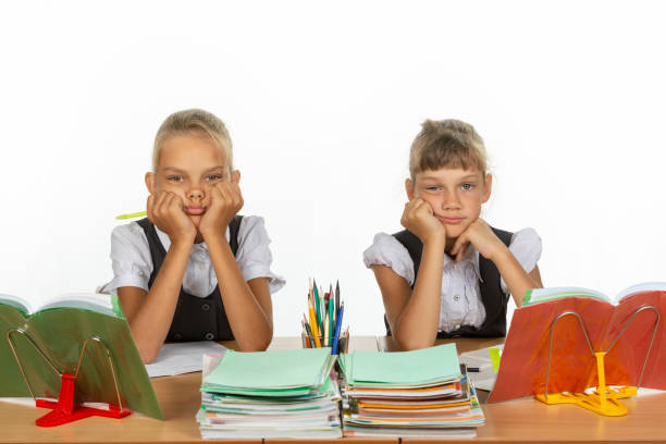istock Two girls do not want to study in class 1167332456