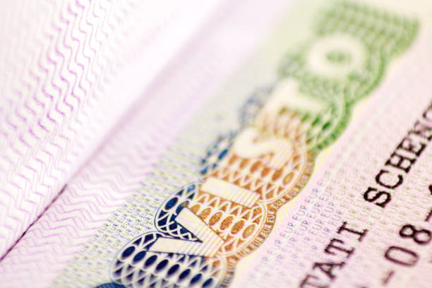 istock close up macro of Schengen visa header in passport. 1167332786
