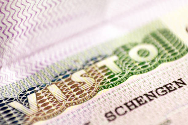 istock close up macro of Schengen visa header in passport. 1167332789