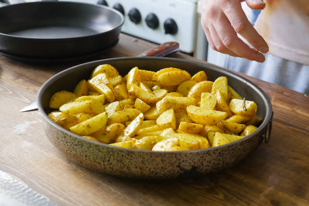 istock Fried potatoes with spices in pan. Spices on the potato. 1167332913