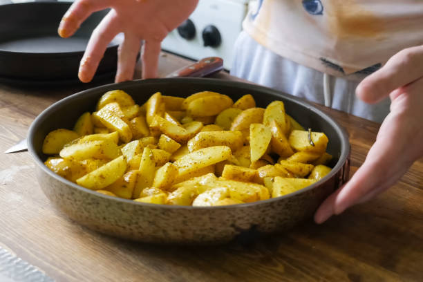 istock Fried potatoes with spices in pan. Spices on the potato. 1167332927