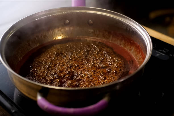 istock Boiling jam, jam to jam. boiling on fire in steel plate. 1167332936