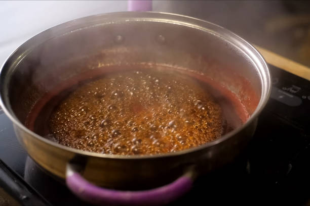 istock Boiling jam, jam to jam. boiling on fire in steel plate. 1167332946