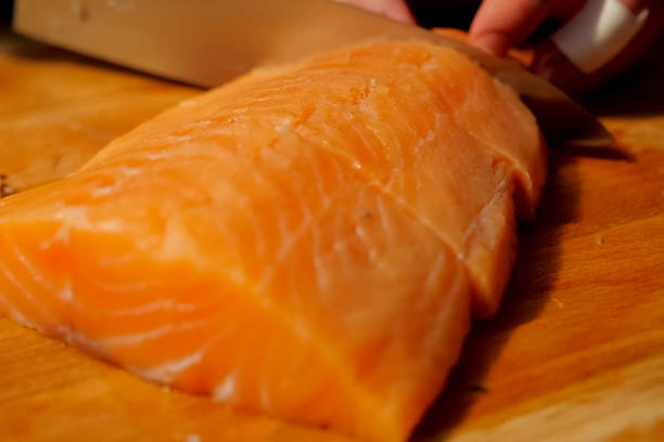 istock slicing red fish on the board. Pieces of red 1167332964